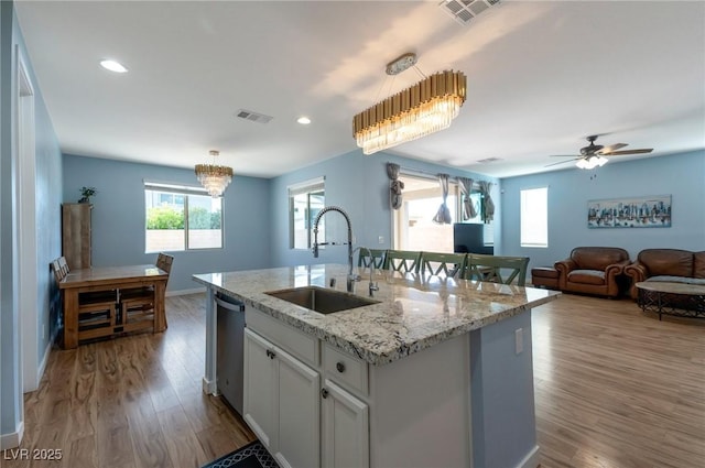 754 Tallgrass St, Las Vegas, NV 89138 - kitchen with a sink, stainless steel dishwasher, wood finished floors, plenty of natural light, and recessed lighting