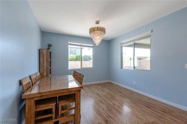 754 Tallgrass St, Las Vegas, NV 89138 - unfurnished dining area featuring a chandelier, wood finished floors, and baseboards