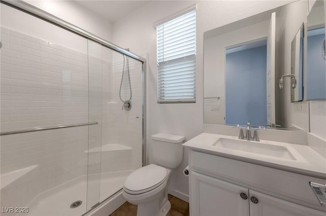 754 Tallgrass St, Las Vegas, NV 89138 - bathroom featuring toilet, a shower stall, vanity, and plenty of natural light