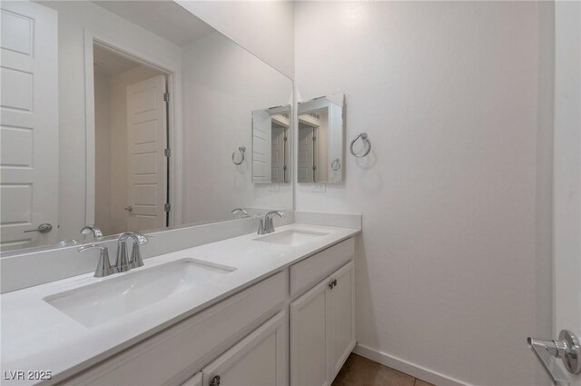 754 Tallgrass St, Las Vegas, NV 89138 - bathroom featuring double vanity, baseboards, and tile patterned flooring