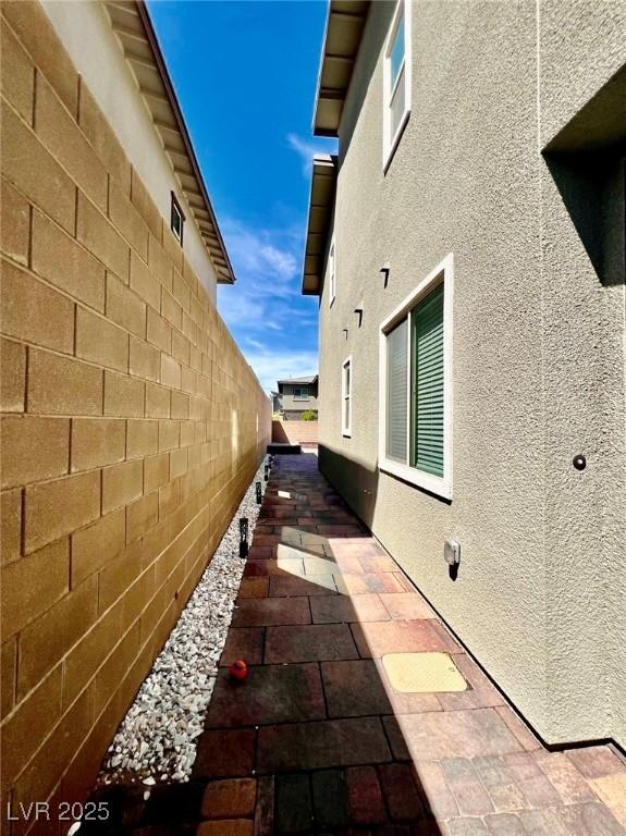 754 Tallgrass St, Las Vegas, NV 89138 - view of property exterior featuring a patio and stucco siding