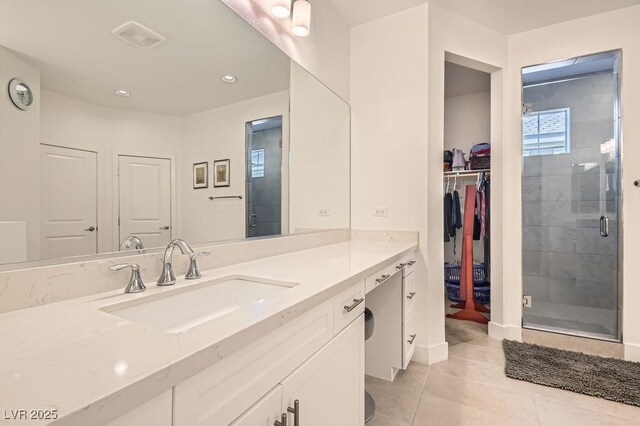 130 W Fairway Rd, Henderson, NV 89015 - full bath with vanity, a shower stall, tile patterned flooring, recessed lighting, and a walk in closet