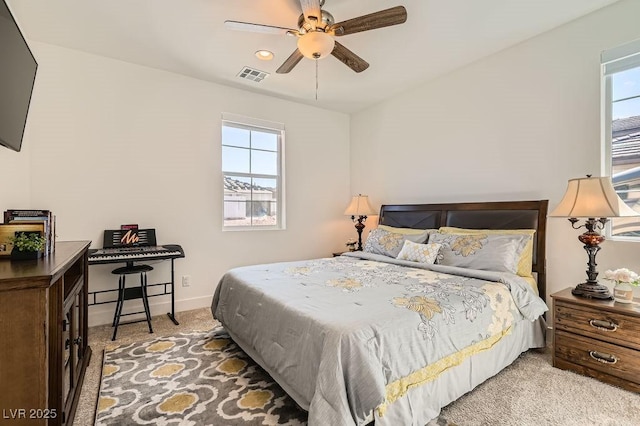 130 W Fairway Rd, Henderson, NV 89015 - bedroom with light colored carpet, multiple windows, and baseboards