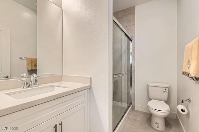 130 W Fairway Rd, Henderson, NV 89015 - full bath featuring toilet, a shower stall, vanity, tile patterned floors, and baseboards