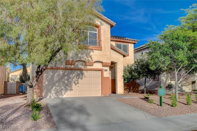 10988 Salernes St, Las Vegas, NV 89141 - mediterranean / spanish-style home featuring an attached garage, stucco siding, driveway, and a tile roof