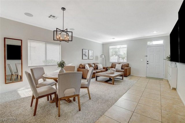 10988 Salernes St, Las Vegas, NV 89141 - dining room featuring crown molding, light tile patterned flooring, a chandelier, and baseboards