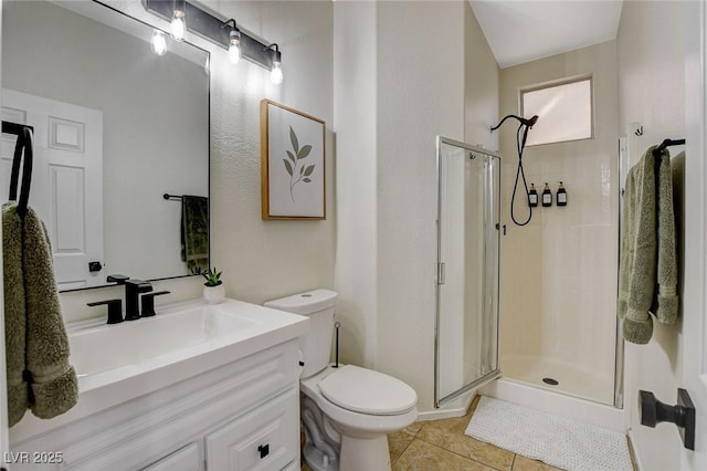 10988 Salernes St, Las Vegas, NV 89141 - bathroom with toilet, a shower stall, tile patterned flooring, and vanity