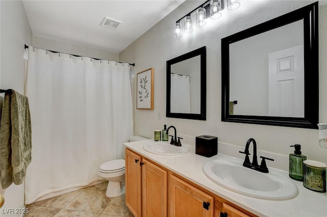 10988 Salernes St, Las Vegas, NV 89141 - full bath featuring double vanity, toilet, a shower with curtain, and tile patterned floors