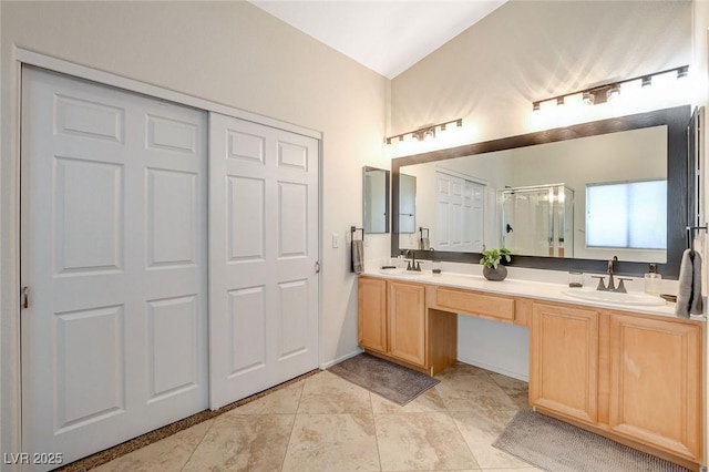 10988 Salernes St, Las Vegas, NV 89141 - full bathroom featuring a shower stall, double vanity, and tile patterned floors