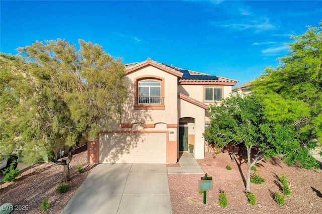 10988 Salernes St, Las Vegas, NV 89141 - mediterranean / spanish home with stucco siding, roof mounted solar panels, a garage, driveway, and a tiled roof