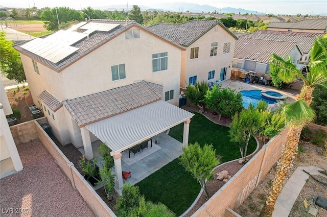 10988 Salernes St, Las Vegas, NV 89141 - view of subject property with a pool area and a mountain backdrop