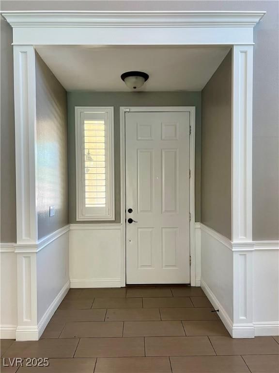 1921 Moonlight Bluff Ave, North Las Vegas, NV 89084 - entrance foyer with tile patterned floors and baseboards
