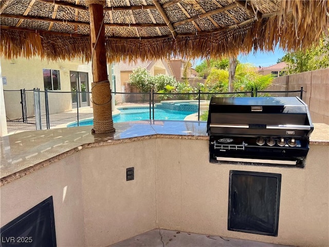 1921 Moonlight Bluff Ave, North Las Vegas, NV 89084 - view of swimming pool featuring a gazebo, a pool with connected hot tub, a patio area, and an outdoor kitchen