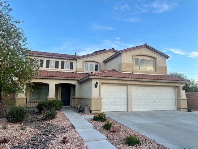1921 Moonlight Bluff Ave, North Las Vegas, NV 89084 - mediterranean / spanish-style house featuring stucco siding, concrete driveway, a porch, a tile roof, and a garage
