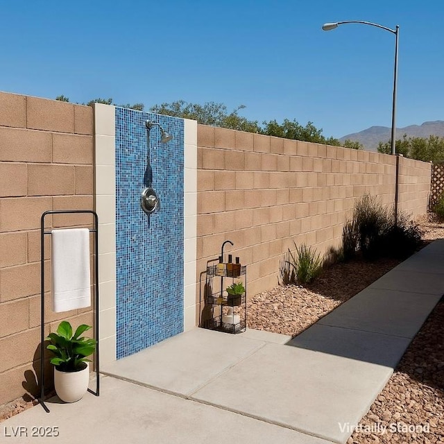 1921 Moonlight Bluff Ave, North Las Vegas, NV 89084 - view of yard featuring a mountain view and a patio area