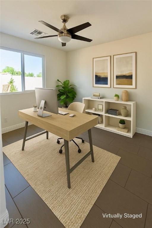 1921 Moonlight Bluff Ave, North Las Vegas, NV 89084 - office with a ceiling fan and dark tile patterned flooring