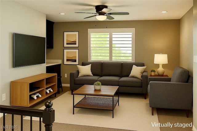 1921 Moonlight Bluff Ave, North Las Vegas, NV 89084 - living room with a ceiling fan, light carpet, and recessed lighting
