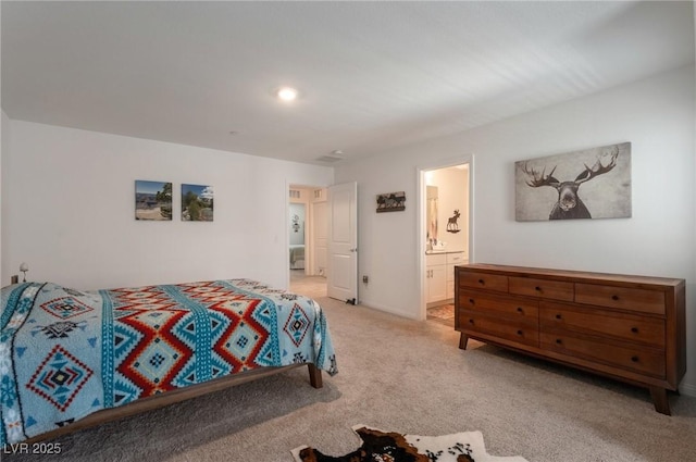 12348 Golden Wreath Rd Unit 1, Las Vegas, NV 89183 - bedroom featuring light colored carpet and ensuite bathroom