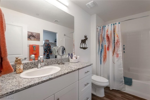 12348 Golden Wreath Rd Unit 1, Las Vegas, NV 89183 - bathroom featuring toilet, vanity, wood finished floors, and shower / bath combo