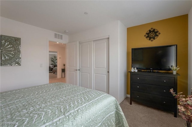 12348 Golden Wreath Rd Unit 1, Las Vegas, NV 89183 - bedroom with light colored carpet, a closet, and baseboards