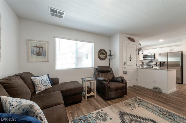 12348 Golden Wreath Rd Unit 1, Las Vegas, NV 89183 - living area featuring wood finished floors and baseboards