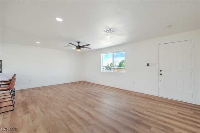 5200 Blanton Dr, Las Vegas, NV 89122 - unfurnished living room with light wood finished floors, ceiling fan, baseboards, and recessed lighting