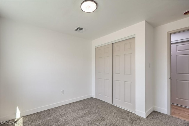 5200 Blanton Dr, Las Vegas, NV 89122 - unfurnished bedroom with a closet, carpet floors, and baseboards