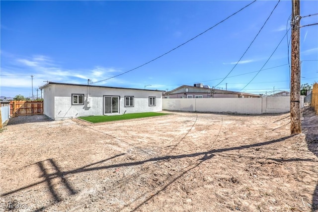 5200 Blanton Dr, Las Vegas, NV 89122 - back of house featuring a fenced backyard and stucco siding