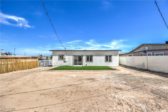 5200 Blanton Dr, Las Vegas, NV 89122 - rear view of house with stucco siding and a patio area