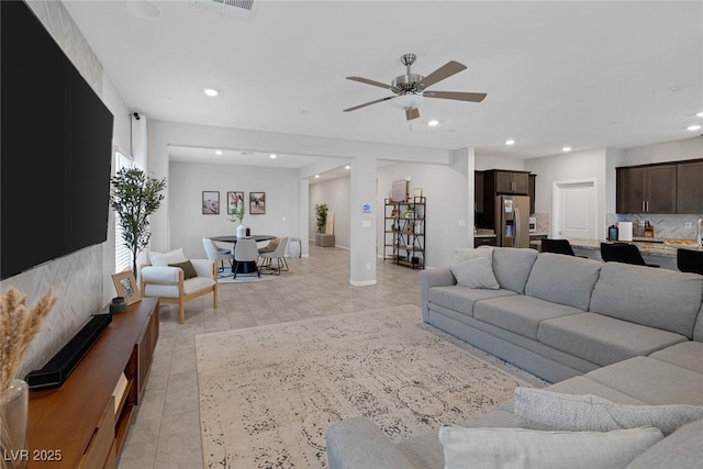 5234 Savannah Rose St, Las Vegas, NV 89149 - living room with recessed lighting, ceiling fan, light tile patterned flooring, and baseboards