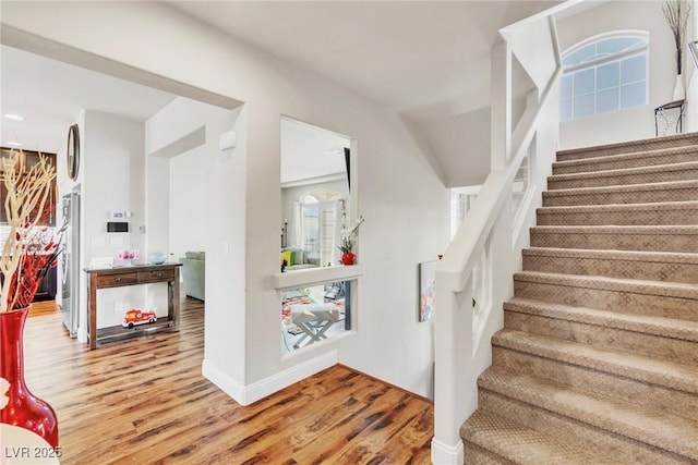 5889 Thistle Meadow Ave, Las Vegas, NV 89139 - stairs featuring wood finished floors and baseboards