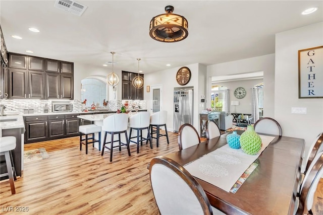 5889 Thistle Meadow Ave, Las Vegas, NV 89139 - dining space with light wood finished floors and recessed lighting