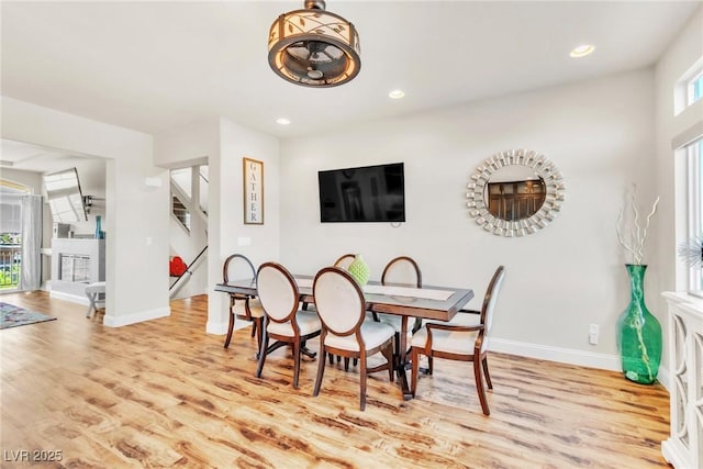 5889 Thistle Meadow Ave, Las Vegas, NV 89139 - dining space featuring light wood-style floors, recessed lighting, and stairway