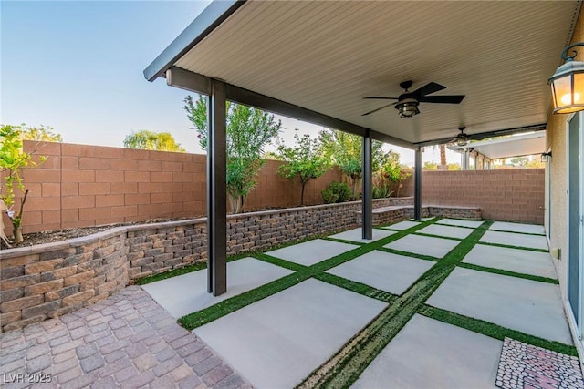 5889 Thistle Meadow Ave, Las Vegas, NV 89139 - fenced backyard featuring a ceiling fan and a patio