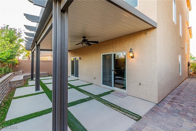 5889 Thistle Meadow Ave, Las Vegas, NV 89139 - fenced backyard featuring ceiling fan and a patio area