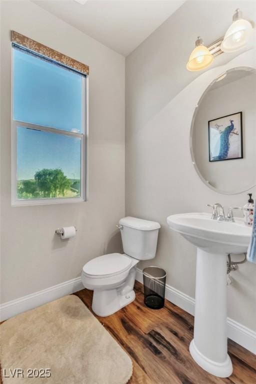 5889 Thistle Meadow Ave, Las Vegas, NV 89139 - half bath featuring wood finished floors and toilet