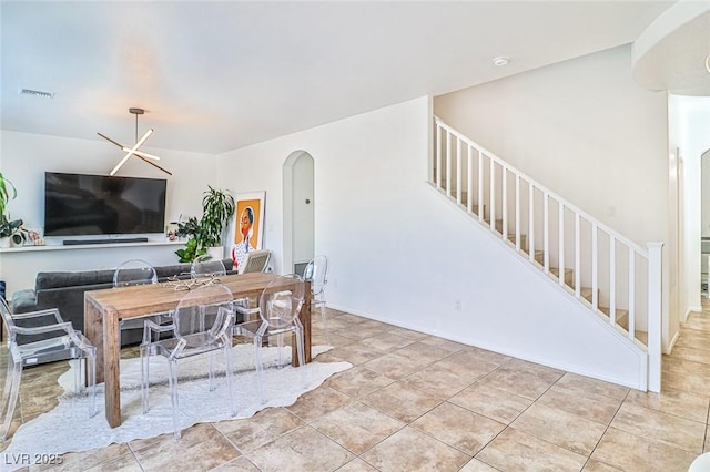 10667 Olympic Pine Dr, Las Vegas, NV 89135 - living area with stairway and arched walkways