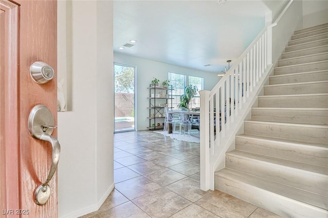 10667 Olympic Pine Dr, Las Vegas, NV 89135 - entryway featuring stairs, light tile patterned floors, baseboards, and recessed lighting
