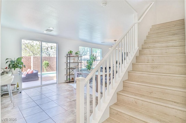 10667 Olympic Pine Dr, Las Vegas, NV 89135 - staircase with tile patterned flooring