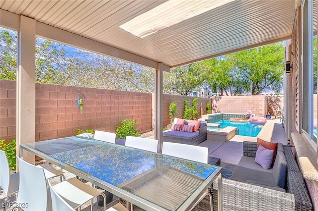 10667 Olympic Pine Dr, Las Vegas, NV 89135 - fenced backyard with outdoor lounge area and a patio