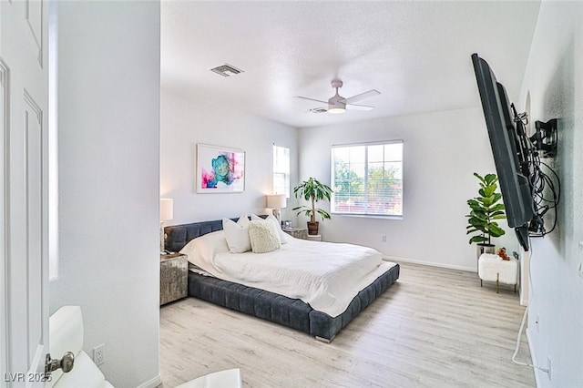 10667 Olympic Pine Dr, Las Vegas, NV 89135 - bedroom with wood finished floors, baseboards, and ceiling fan