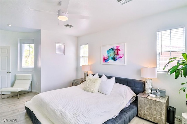 10667 Olympic Pine Dr, Las Vegas, NV 89135 - bedroom with light wood-style floors and a ceiling fan