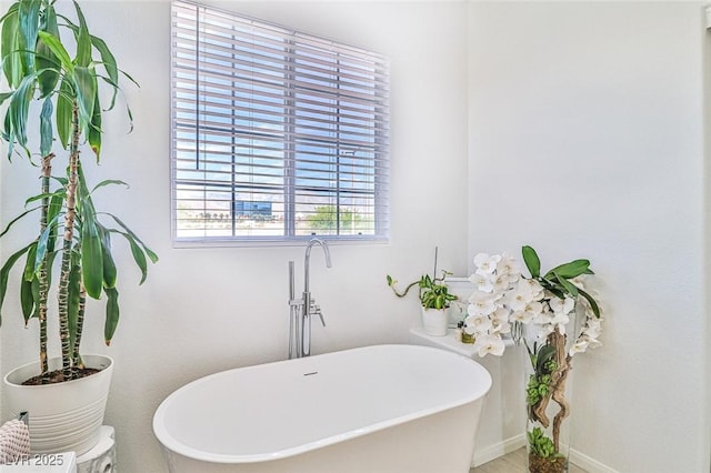 10667 Olympic Pine Dr, Las Vegas, NV 89135 - bathroom with a freestanding tub and baseboards