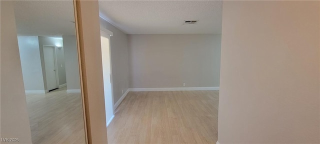 3151 Soaring Gulls Dr Unit 1074, Las Vegas, NV 89128 - hallway with light wood-style floors, a textured ceiling, and baseboards