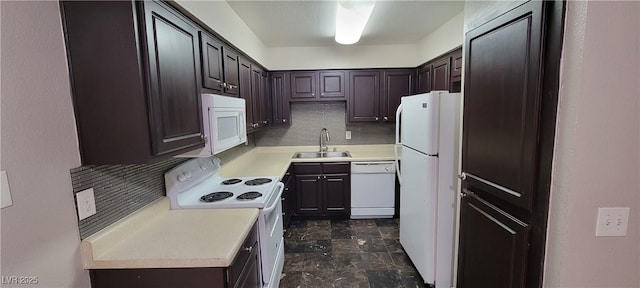 3151 Soaring Gulls Dr Unit 1074, Las Vegas, NV 89128 - kitchen with white appliances, a sink, light countertops, backsplash, and dark brown cabinetry