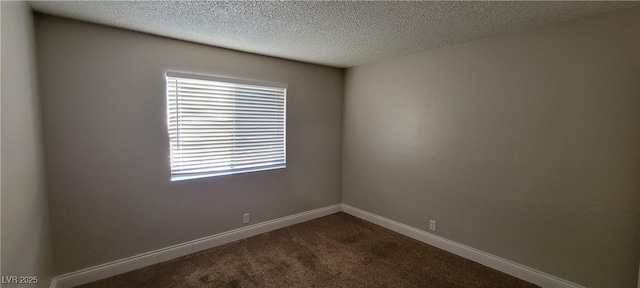 3151 Soaring Gulls Dr Unit 1074, Las Vegas, NV 89128 - unfurnished room with healthy amount of natural light, a textured ceiling, dark carpet, and baseboards