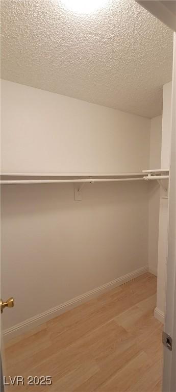 3151 Soaring Gulls Dr Unit 1074, Las Vegas, NV 89128 - walk in closet featuring light wood-type flooring