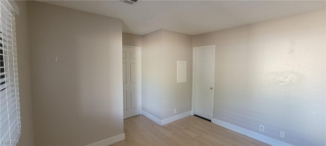 3151 Soaring Gulls Dr Unit 1074, Las Vegas, NV 89128 - unfurnished bedroom with light wood-type flooring and baseboards