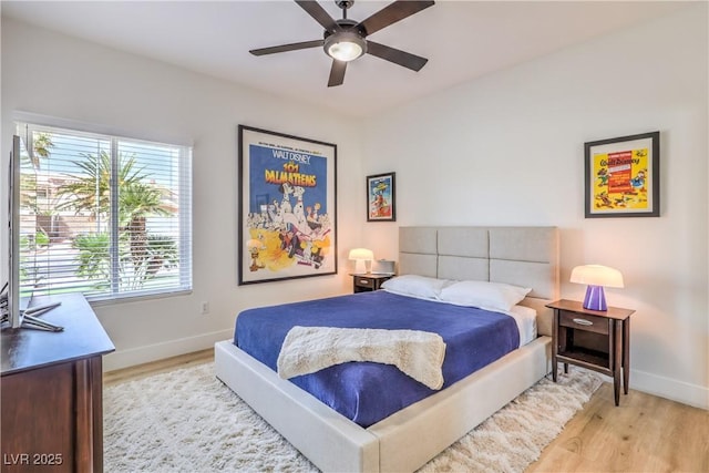 3028 Treesdale Dr, Las Vegas, NV 89134 - bedroom with baseboards, light wood finished floors, and a ceiling fan