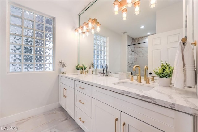 3028 Treesdale Dr, Las Vegas, NV 89134 - bathroom featuring marble look tiles, double vanity, a marble finish shower, baseboards, and recessed lighting